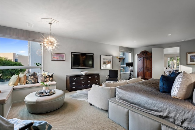 bedroom with multiple windows, a notable chandelier, and carpet flooring