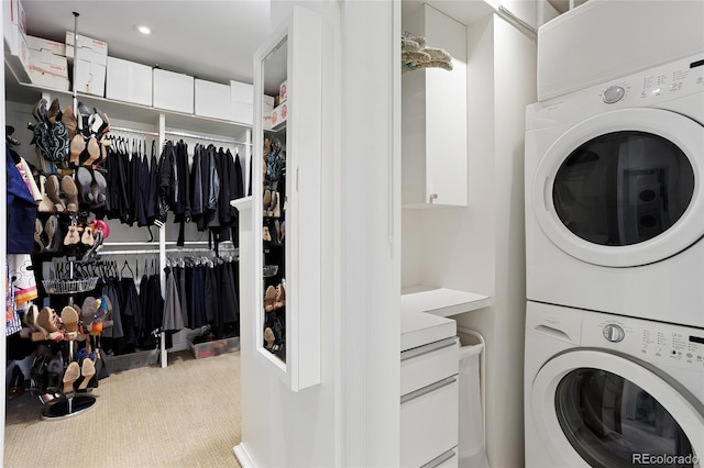 laundry room with laundry area, stacked washer / dryer, recessed lighting, and carpet