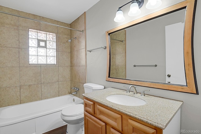 full bathroom with vanity, shower / tub combination, and toilet