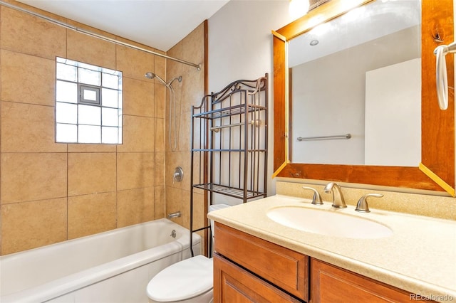 bathroom featuring bathtub / shower combination, toilet, and vanity