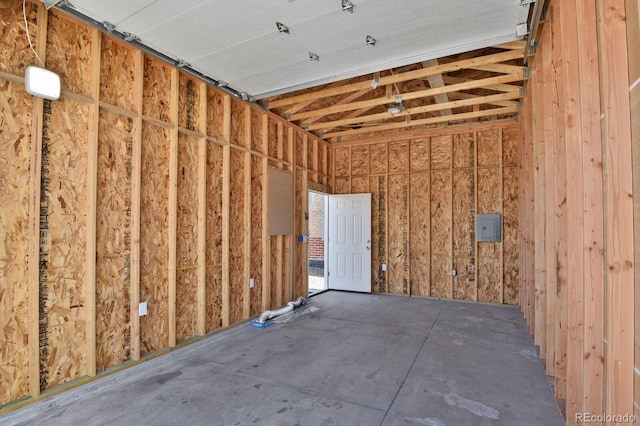 interior space featuring electric panel and a garage