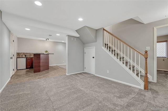 living room featuring stairs, carpet, baseboards, and recessed lighting