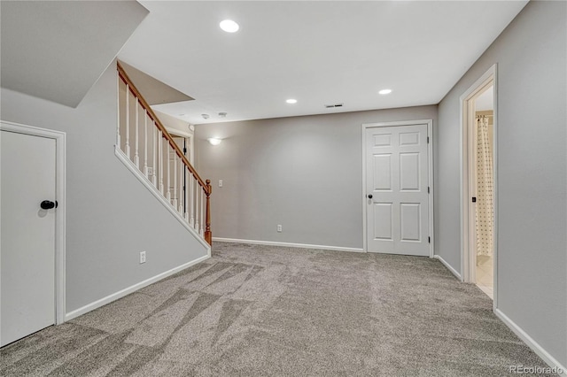 unfurnished room with carpet floors, recessed lighting, stairway, and baseboards