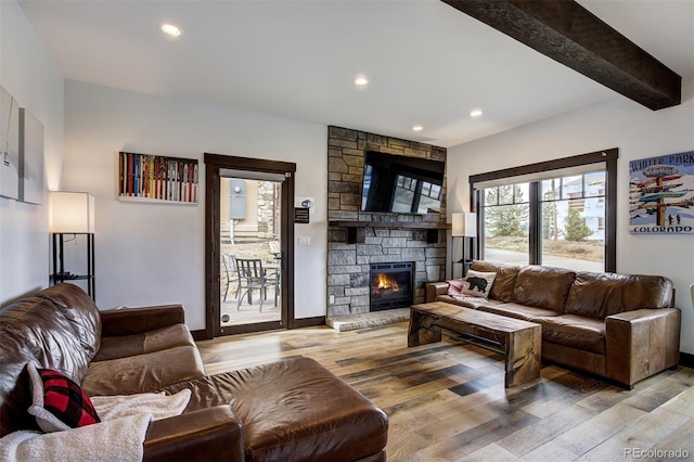 200 Quill, Fraser, CO 80442 - living area with wood finished floors, a fireplace, recessed lighting, and beam ceiling