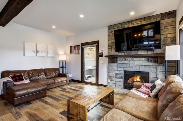 200 Quill, Fraser, CO 80442 - living area featuring wood finished floors, a stone fireplace, baseboards, and recessed lighting