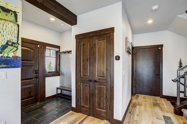 200 Quill, Fraser, CO 80442 - entryway featuring wood finished floors, baseboards, recessed lighting, and vaulted ceiling
