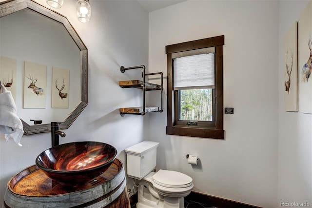 200 Quill, Fraser, CO 80442 - bathroom featuring toilet, baseboards, and vanity