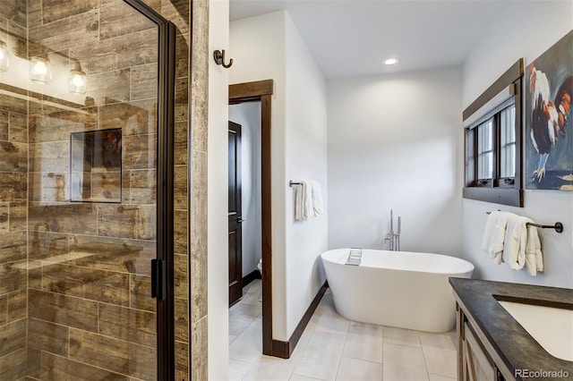 200 Quill, Fraser, CO 80442 - bathroom featuring a shower stall, a soaking tub, tile patterned floors, vanity, and recessed lighting