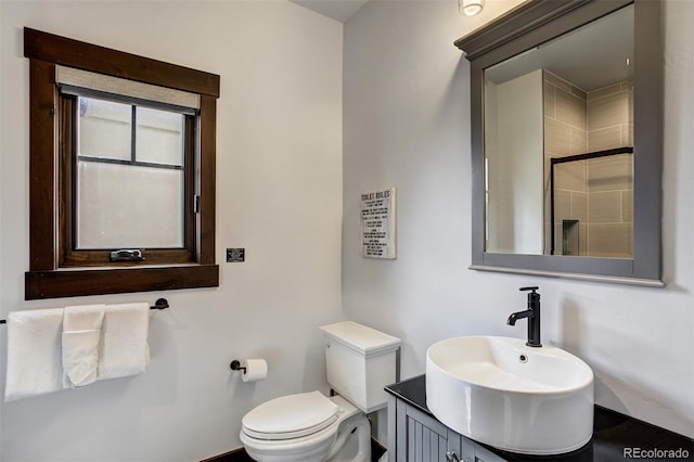200 Quill, Fraser, CO 80442 - bathroom featuring toilet, tiled shower, and vanity