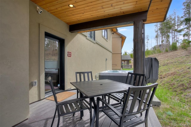 200 Quill, Fraser, CO 80442 - view of patio / terrace with outdoor dining space and a hot tub