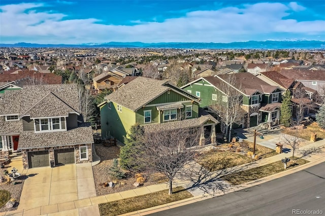 birds eye view of property with a mountain view and a residential view