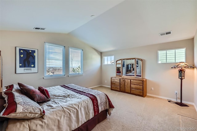 bedroom featuring baseboards, visible vents, carpet floors, and lofted ceiling