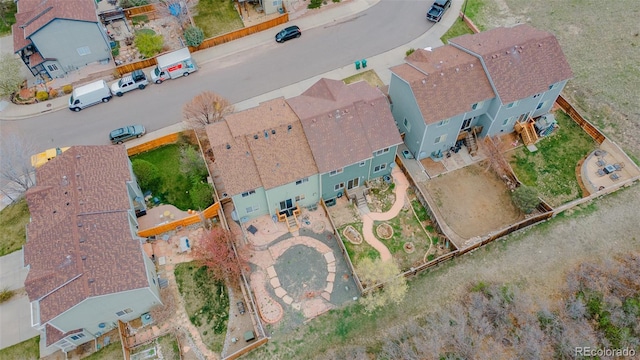 birds eye view of property with a residential view