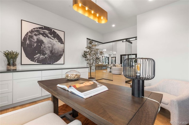 dining space with light hardwood / wood-style floors