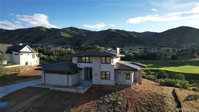 view of front of home featuring a mountain view and a chimney