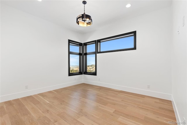 unfurnished room featuring light hardwood / wood-style flooring