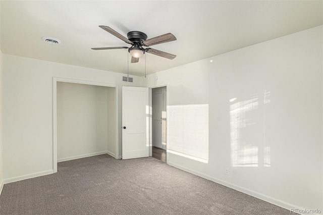 unfurnished bedroom featuring carpet flooring and ceiling fan