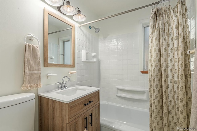 full bathroom with shower / tub combo, vanity, and toilet