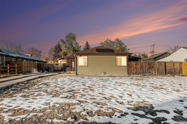 back house at dusk with solar panels