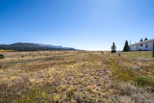 mountain view featuring a rural view