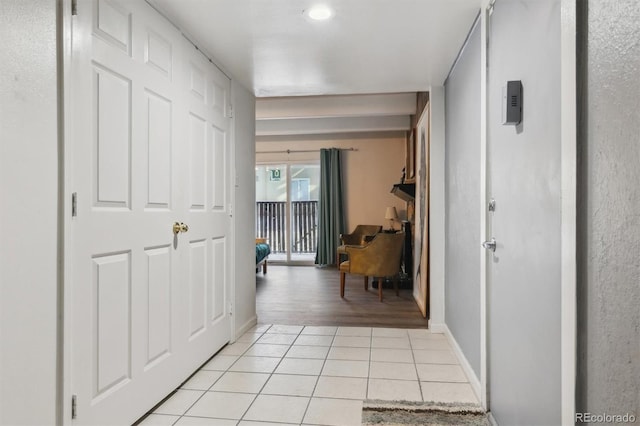 hallway with light tile patterned floors