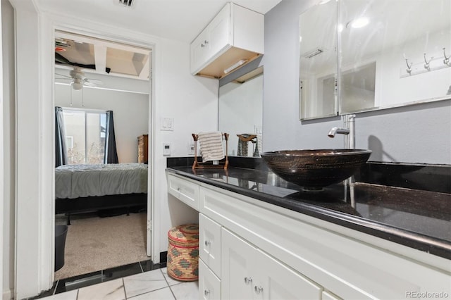 bathroom featuring vanity, tile patterned floors, and ceiling fan