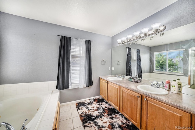 10289 Dresden St, Firestone, CO 80504 - full bathroom featuring a garden tub, double vanity, tile patterned floors, and baseboards