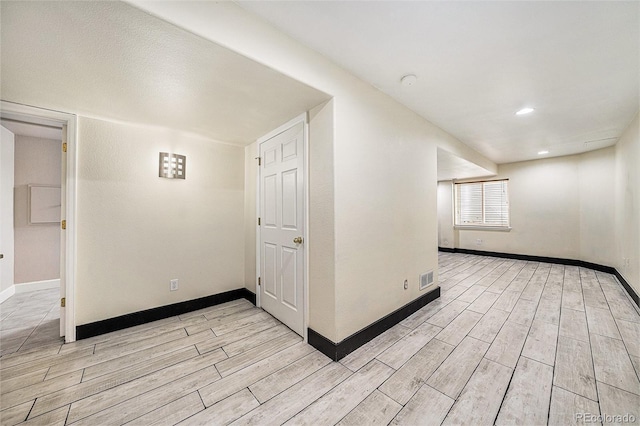 10289 Dresden St, Firestone, CO 80504 - unfurnished room with light wood-style floors, baseboards, a smoke detector, and recessed lighting