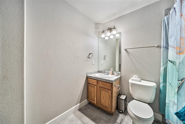 10289 Dresden St, Firestone, CO 80504 - full bath featuring vanity, a textured wall, tile patterned floors, toilet, and baseboards