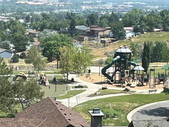 view of community featuring playground community and a yard