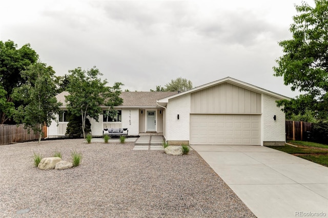 11762 W 34th Ave, Wheat Ridge, CO 80033 - ranch-style house featuring an attached garage and concrete driveway