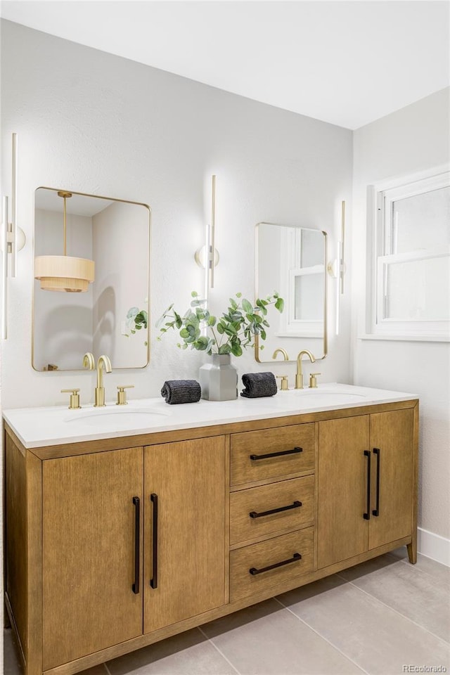11762 W 34th Ave, Wheat Ridge, CO 80033 - bathroom with double vanity, tile patterned flooring, and baseboards