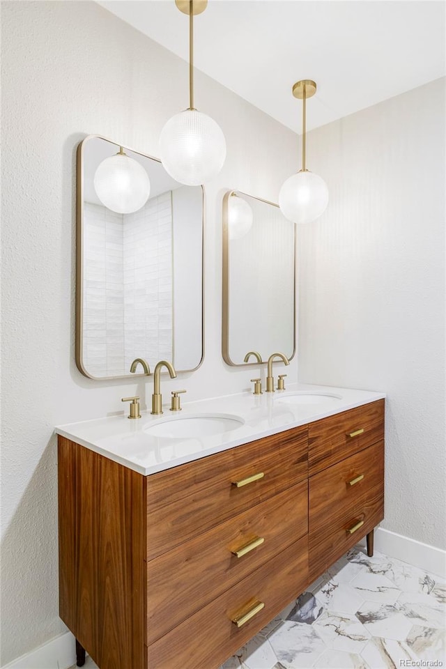 11762 W 34th Ave, Wheat Ridge, CO 80033 - full bathroom with double vanity, marble finish flooring, and baseboards