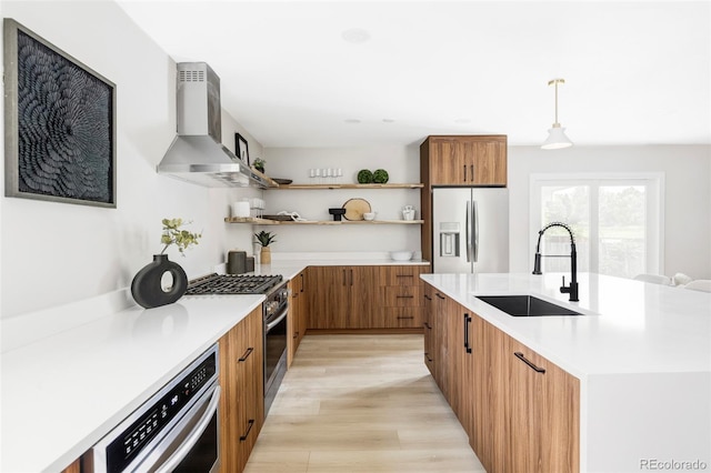 11762 W 34th Ave, Wheat Ridge, CO 80033 - kitchen with stainless steel appliances, island range hood, open shelves, brown cabinets, and light countertops