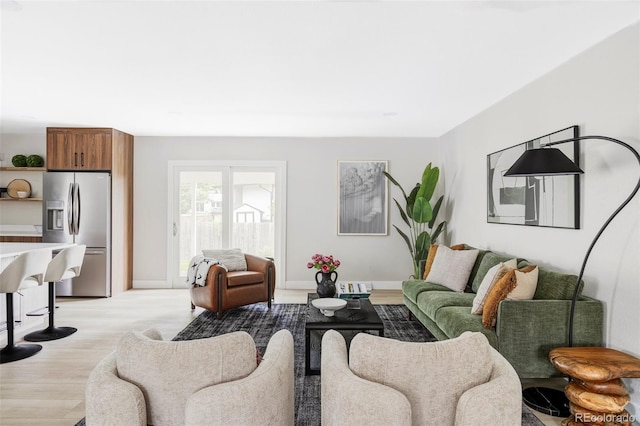 11762 W 34th Ave, Wheat Ridge, CO 80033 - living area featuring light wood-style floors and baseboards