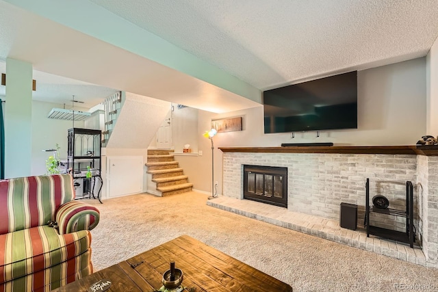 19196 E Kansas Dr, Aurora, CO 80017 - carpeted living room featuring a brick fireplace, stairs, and a textured ceiling