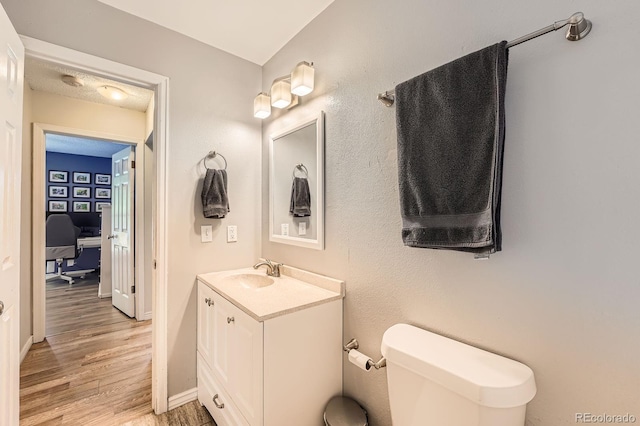 19196 E Kansas Dr, Aurora, CO 80017 - bathroom featuring vanity and wood finished floors