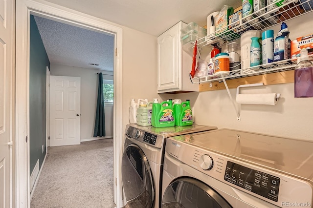 19196 E Kansas Dr, Aurora, CO 80017 - laundry room featuring washing machine and clothes dryer, cabinet space, light colored carpet, and a textured ceiling