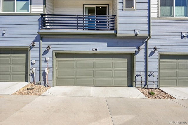 garage with concrete driveway