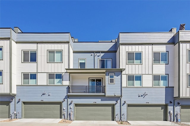 multi unit property with driveway and a garage