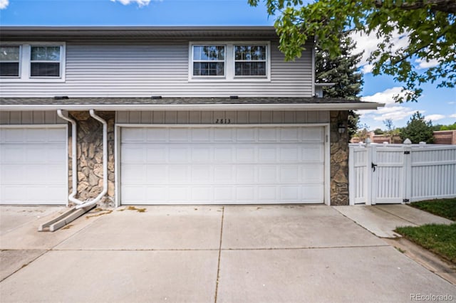 2813 S Xanadu Way, Aurora, CO 80014 - garage with a gate and concrete driveway