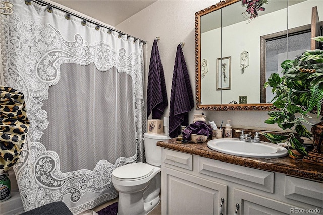2813 S Xanadu Way, Aurora, CO 80014 - bathroom with vanity, toilet, and curtained shower