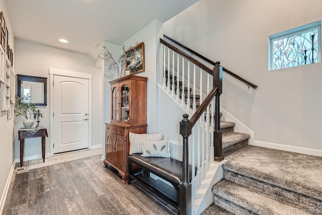 16546 Umatilla Pl, Broomfield, CO 80023 - stairs with wood finished floors, baseboards, and recessed lighting