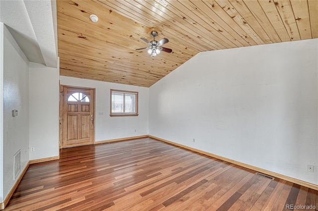 interior space featuring visible vents, wood finished floors, lofted ceiling, and a ceiling fan