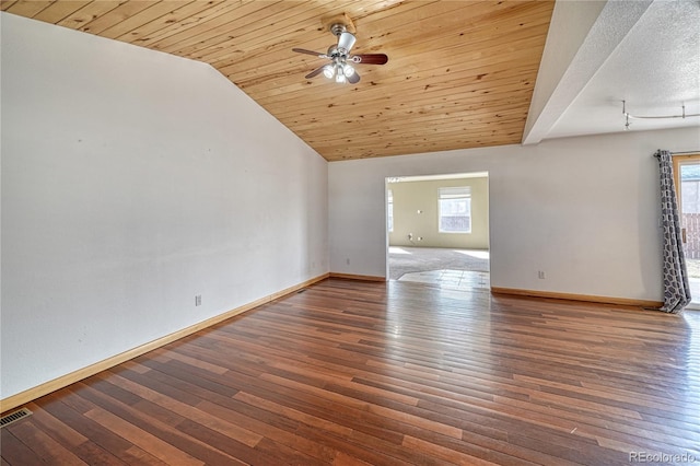 empty room featuring baseboards, a ceiling fan, lofted ceiling, wood ceiling, and wood-type flooring