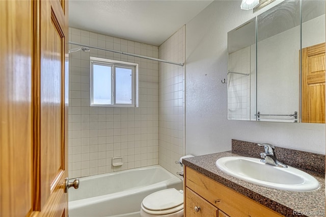 bathroom with  shower combination, toilet, and vanity