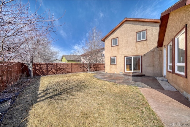 view of yard with a patio and a fenced backyard