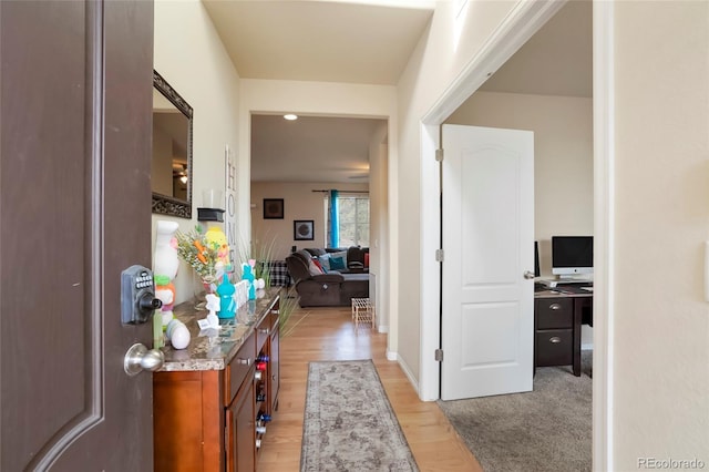 hallway featuring light wood finished floors