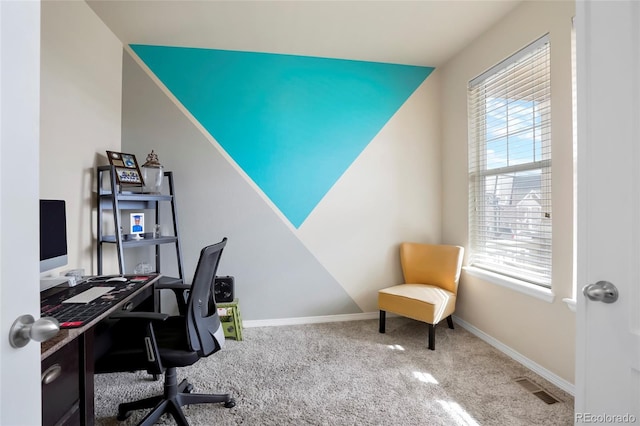 office area featuring visible vents, baseboards, and carpet floors