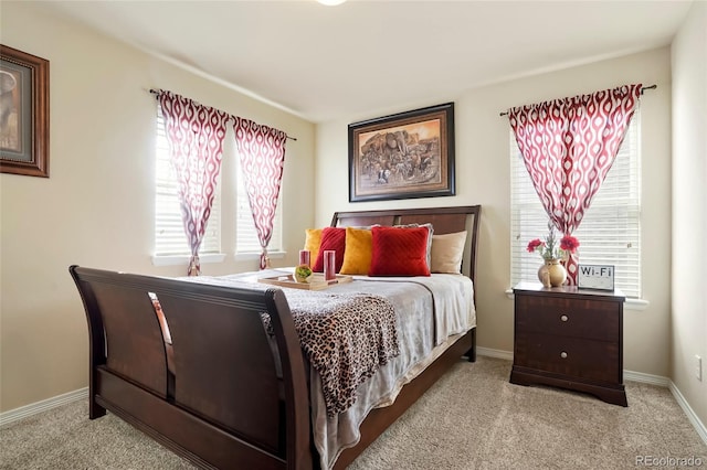 carpeted bedroom with baseboards